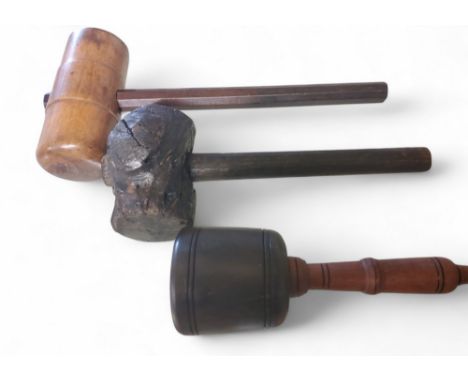 A rustic hammer, 28cm long;&nbsp; a large gavel, 35cm long;&nbsp; a mallet (3)