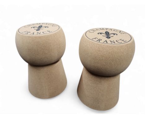 A pair of novelty stools, in the form of champagne corks, 51cm high