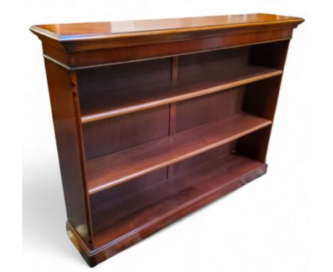 A reproduction mahogany open bookcase, 111cm x 150cm