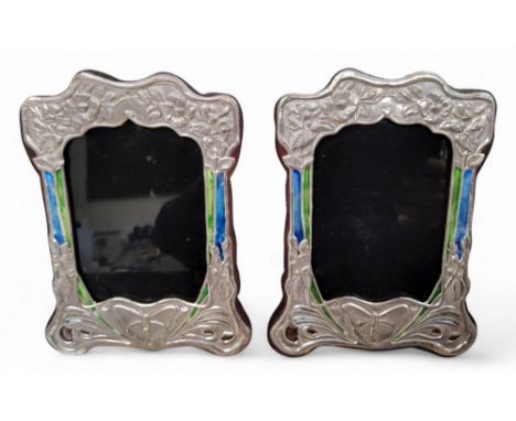 A pair of Art Nouveau style shaped rectangular sterling silver and enamel easel photograph frames, embossed with butterflies 