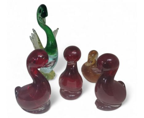 Three Whitefriars glass ruby red Dilly Ducks, designed by Geoffrey Baxter, 13cm high;&nbsp; &nbsp;an orange duck;&nbsp; a gre