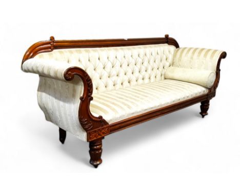 A Victorian mahogany scroll end sofa, upholstered in cream, boldly turned legs, castors, 97cm x 230cm