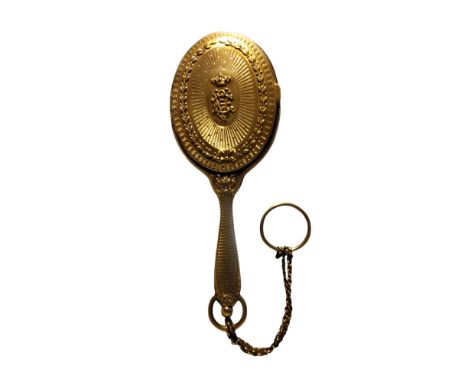 An early 20th century French silver gilt combination hand mirror/aide memoir, hinged back, embossed with crest and ribbon tie