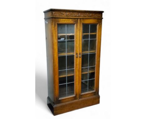 An Old Charm type golden oak astrigal glazed bookcase, 137cm x 75cm x 39cm