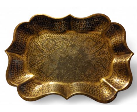 An 18th century Islamic damascened dish, of shaped rectangular form, 10cm wide