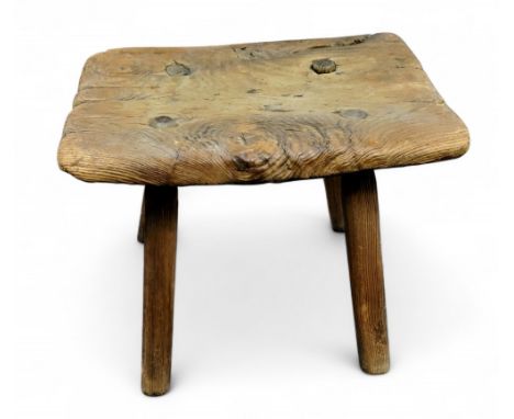 An early 19th century rustic joint stool, rectangular top, splayed cylindrical legs, 30cm high, 36cm wide