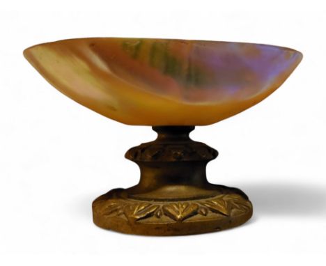 A 19th century gilt metal and&nbsp; mother-of-pearl salt, the pedestal with stiff leaves, 9cm wide, c.1870