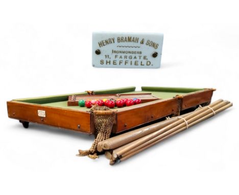 A Henry Bramah &amp; Sons of Sheffield table top slate bed billiards table, with score board, cues, etc, 12.5cm x 111cm x 58c