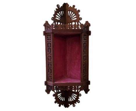 A Continental walnut ecclesiastical fretwork icon corner shelf, 68cm x 25cm x 18.5cm