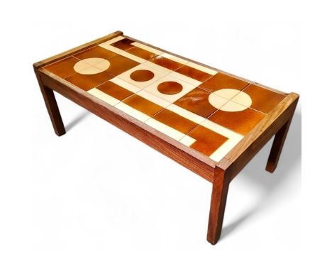 A mid 20th century teak coffee table with geometric treacle glazed tile design, possibly Danish, 40cm x 100cm x 50cm, c.1970