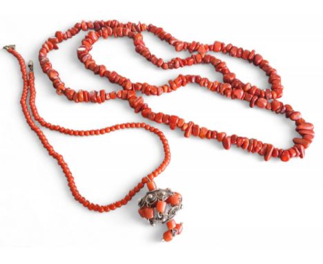 A coral bead necklace, a white metal wirework and coral pendant; a natural coral chip necklace