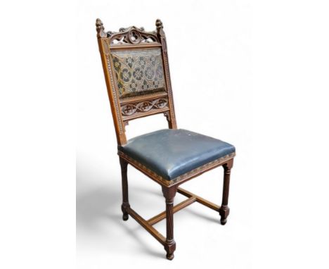 An early 19th century Continental chestnut Gothic Revival drawing room chair,&nbsp; pressed leather backrest picked out in gi