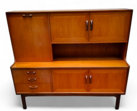 A mid 20th century teak G-Plan 'Sierra range' high-backed sideboard c.1970, fall front over a bank of three graduated drawers