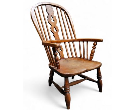 An early 19th century ash and elm Windsor chair, vascular splat, reduced in height, seat height 30cm