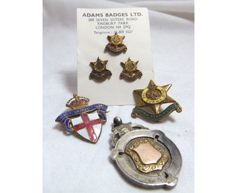 SILVER FOB. Enamel badges and a silver fob
