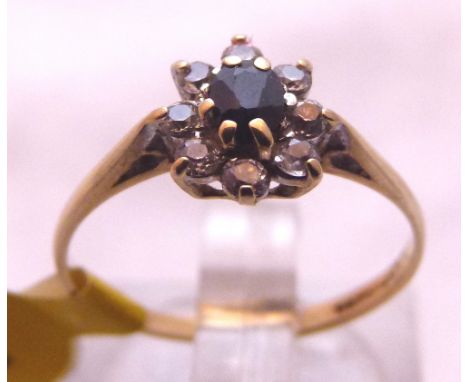 SAPPHIRE CLUSTER RING. 9 ct gold sapphire and CZ cluster ring, size J/K