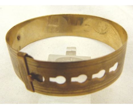 GOLD BANGLE. 9 ct gold front and back belt bangle CONDITION REPORT: The item is in good condition, inner diameter when full e
