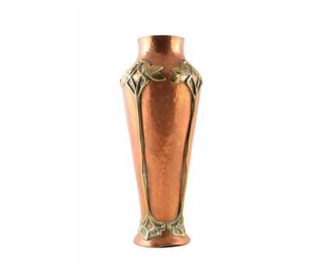 An Art Nouveau copper and brass vase by the WMF Group, Berlin. The hammered copper vase middle is threaded on four sides with