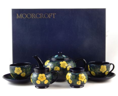 Moorcroft boxed tea for two set, decorated with buttercup pattern after Sally Tuffin, to include teapot and cover, sugar bowl