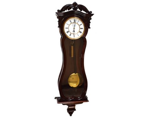 A 19th century rosewood single weight Vienna regulator with serpentine case. The rounded arch pediment has scrolled crown fin