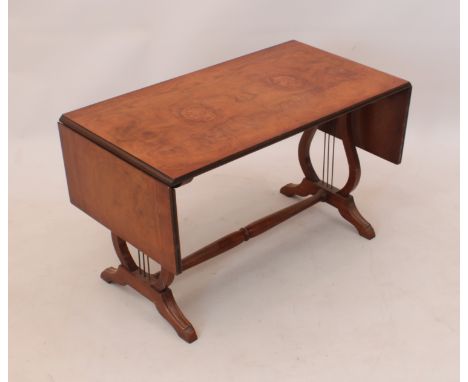 A small mahogany sofa table-style coffee table - second half 20th century, the dropflap, boxwood strung top on lyre supports 