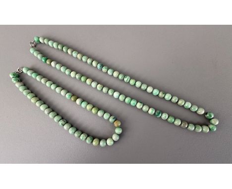 A set of two vintage short and long jade bead necklaces - mid-20th century, both necklaces with 9.5mm beads in mottled apple 