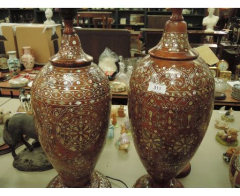A pair of ceramic lamps inlayed with mother of pearl