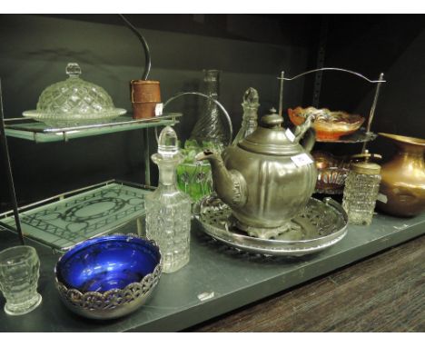 A shelf of glass and plated ware including cake stand etc