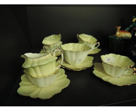 A vintage part tea service in lime and gilt