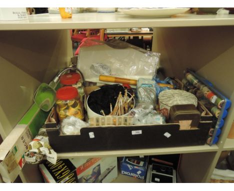 A shelf of haberdashery including lace bobbins, buttons, etc