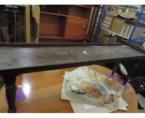 An early 20th century mahogany bench planter on turned legs