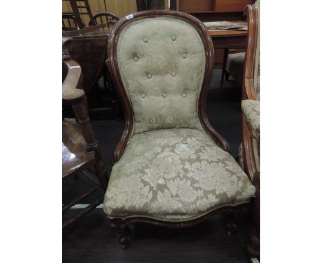 A Victorian mahogany frame spoon back chair having later floral upholstery on knurl legs