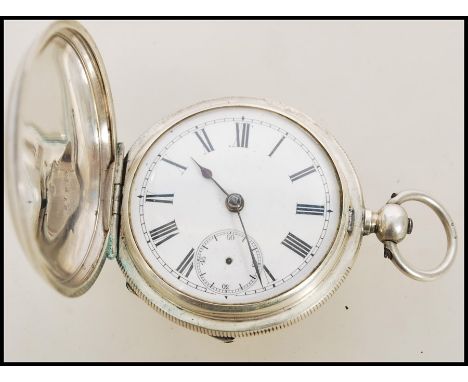 A 19th century Victorian silver 935 full hunter pocket watch having a fusee movement. The white enamel face having a Roman nu