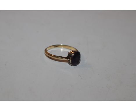 An 18ct gold ring set with amethyst coloured stone, ring size O, approx. total weight 2.4gms