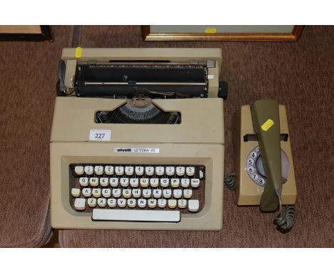 An Olivetti Lettera 25 portable typewriter; and a 1960's / 70's trim phone 