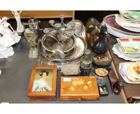 A quantity of silver plated ware; a brass ornament in the form of a golfer; a large wooden duck; and a musical trinket box 