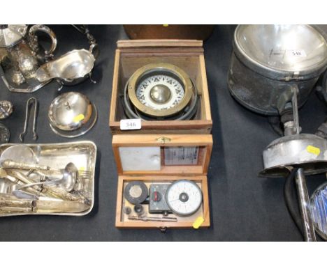 A ships compass and a cased meter