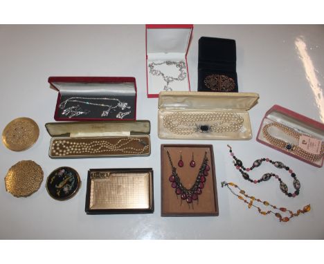 A box of various costume jewellery to include simulated pearl necklaces; paste set necklace; compacts etc