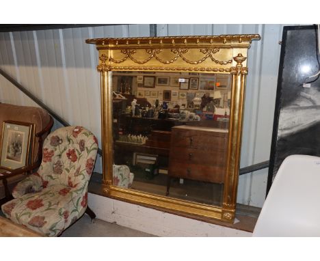 A large gilt framed bevel edged over mantel mirror 