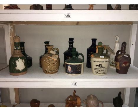 A quantity of ceramic decanters, (some with contents)