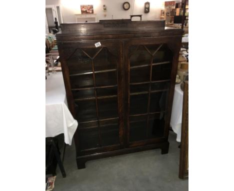 A oak glazed book shelf