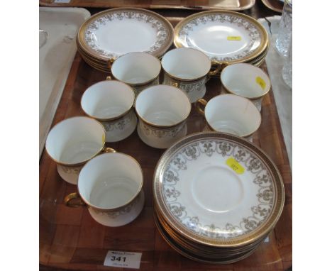 Tray of Cauldon china part tea service on a white ground with foliate swag decoration and gilt Greek key borders, comprising 