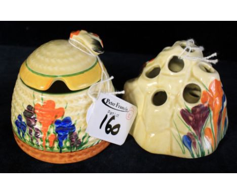 Two Clarice Cliff bizarre crocus pattern items to include preserve jar and cover and spill holder. (2) CONDITION REPORT: Smal