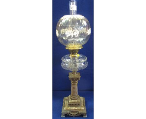 Late 19th/early 20th Century double oil lamp, burner with clear glass reservoir and shade and funnel raised on alabaster squa