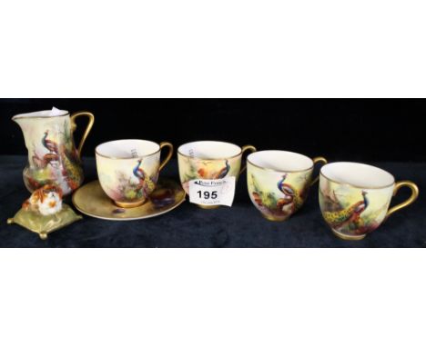 Collection of Royal Worcester porcelain items to include cabinet cups. (4) One saucer, cream jug depicting peacocks and fruit