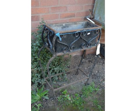 A WROUGHT IRON RECTANGULAR GARDEN PLANTER, width of inner basket 43cm