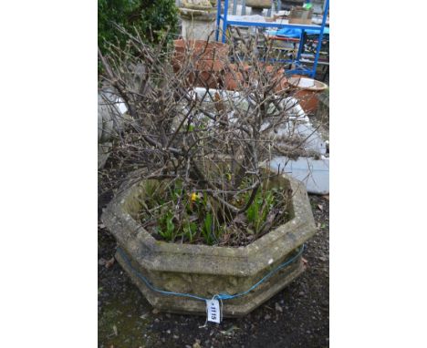 A COMPOSITE OCTAGONAL PLANTER, diameter 65cm x height 26cm