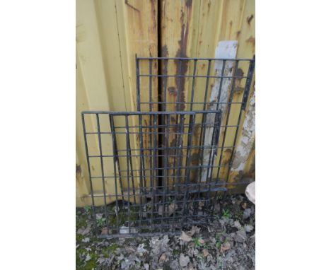 THREE BLACK PAINTED CAST IRON FENCE PANELS, largest panel 122cm x 62cm