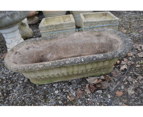 A COMPOSITE OBLONG CAMPANA GARDEN PLANTER with rounded ends, length 88cm x depth 39cm x height 30cm