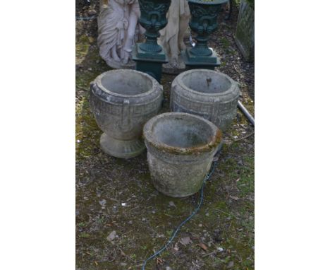 A PAIR OF WEATHERED COMPOSITE GREEK CIRCULAR PLANTERS, diameter 37cm x height 38cm and another circular planter (3)